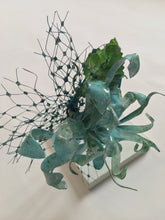 Load image into Gallery viewer, Turquoise and green recycled plastic flower on a turquoise silk metal covered headband.