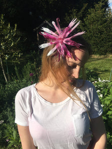 Pink recycled plastic flower on a silk covered metal headband.